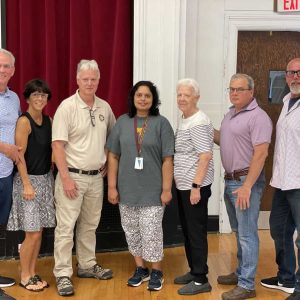 Warren family members with Asha Nair, pictured from left to right: Russell and Laurie Warren, Walter R. Warren, Jr., Asha Nair, Martha Warren, Tommy Burgoin and Michael Warren.