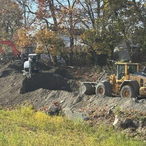 Bulldozers are shown moving dirt and stone onto McMackin Field recently. (Courtesy of Mayor’s Office)