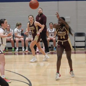 Abby Ssewankambo (#14) and Sylvie LaFeber in the background