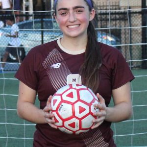 Reilly Hickey holds the ball with which she scored her 100th career goal.