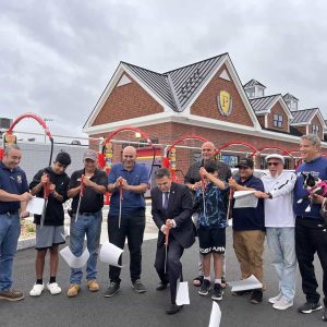 Shown from left to right, are; Scott Green, Ben and Yonan Drory, Ted Colabro, and Nir Drory, all of Prestige Car Wash; Malden Mayor Gary Christenson, City of Malden; and Prestige Car Wash team members Ronen Drory, Edward Solis, Scott Cutler and Danny Wahlberg.