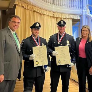 State Representatives Jeffrey Turco and Jessica Ann Giannino are shown with Revere Police Officers Brendon Leslie, right, and Christopher Panzini after the officers were recognized at the 40th Annual Trooper George L. Hanna Memorial Awards for Bravery in Worcester.