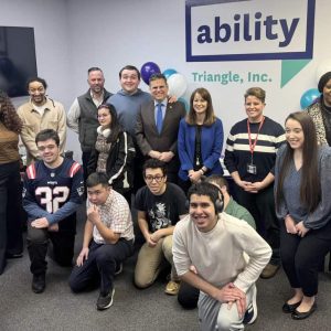 Triangle CEO Rachel Kaprielian (pictured in blue blazer) and Malden Mayor Gary Christenson (pictured to Rachel’s left wearing blue tie) celebrated along with participants the one-year anniversary of its newest program for young adults with disabilities. (Courtesy photo)