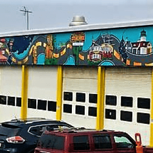 IS THIS REALLY A SIGN Under the town’s current Zoning By-Laws, this mural on the building of Cap World, located on Route 1 North, is considered a sign that needs to be covered up or removed. (2)
