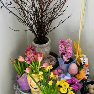 Inspired by spring bulb shows at Mt. Holyoke and Smith Colleges in March, this Easter “bulb show” on my stair landing includes black pussy willows, hyacinths, tulips, orchids, mums, palm fronds and an assortment of bunny, chicken and egg decorations. (Photo courtesy of Laura Eisener)