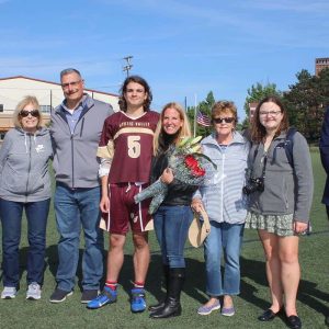 Pictured from left to right: Medford residents — grandfather John, grandmother Patricia, father Richard, senior Daniel Iozza, mother Heidi, grandmother Ilse, cousin Hannah and Superintendent Alexander Dan. Iozzo plans to enlist in the United States Marine Corps after high school graduation.