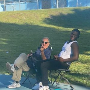 Malden Recreation Director Joe Levine and Malden High School student athlete James Hyppolite.