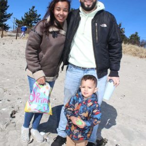 HAPPY EASTER: Shown from left, Crystal, Lucas, 2, and Councillor-At-Large Juan Pablo Jaramillo. Approximately 70 people attended Saturday’s Point of Pines Beach Assoc. third annual Easter Egg Hunt along the Point of Pines beach.  (Advocate photo by Tara Vocino)