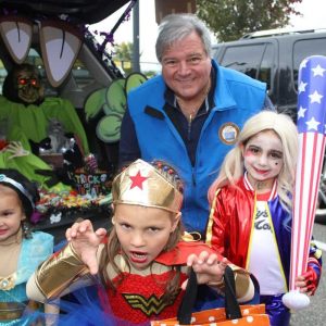 Lucia Fiore, 3, who was dressed as Jasmine, and Jacqueline Fiore, 5, who was dressed as Wonder Woman, and Abby Blazo, 6, who was dressed as Harley Quinn, with mayoral candidate Dan Rizzo.