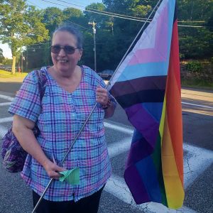 Joan Joyce, 60, said she has been going to the church since she was five years old. She carried a “Pride flag” to show her support. (Saugus Advocate photo by Mark E. Vogler)