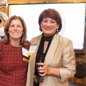 North Suffolk Community Services President and CEO Judi Lemoine (left) presented retired CEO Jackie Moore (right) with the inaugural Legacy Award on Thursday, Oct. 17 at the organization’s 65th anniversary celebration. (Photo Credit: Jenn Cimino)