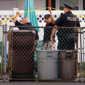Everett and State Police are shown behind the Springvale Ave. home where an 18-year-old female’s body was discovered on Tuesday.  (Photo by Katy Rogers)