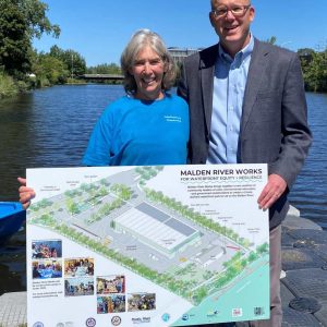 Standing on the bank of the Malden River, Malden resident Karen Buck, shown with Sen. Jason Lewis who nominated Buck, was named 2023 Commonwealth Heroine recently.