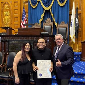 Keithen McKoy Jr. and his mother, Jodi Santagate, visited the State House last week to receive a citation from State Representative Joe McGonagle in recognition and celebration of Keithen’s graduation from Everett High School. This was a momentous occasion as Keithen is one of the only students in the Autistic programs to pass the MCAS and graduate with peers.
