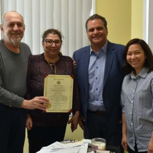 Mayor Carlo DeMaria presented a citation to Kenneth DeSimone alongside DV Tax & Consulting Services LLC staff.