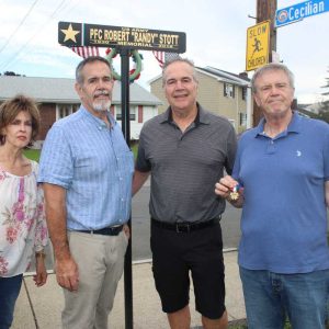 Shown from left to right: daughter Patricia and sons Robert, Dino and John.