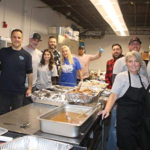 At left, shown from left to right: Michael Scaramozza, Mayor-Elect Patrick Keefe, Jr., Officer Joe Duca, Shannon Duca, Steve Penta and Corrie O’Neil. At right, shown from left to right: Anthony Pio, Rick Griffin, Officer John Papasodora, Denise Papasodora and Alita Bransfield. In the center is The Good Diner owner Saber Abougalala.