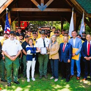 Wellpoint hosted a Hometown Heroes event at Breakheart Reservation in Saugus on August 8 to honor the Forest Fire Control Team of the Department of Conservation & Recreation (DCR) for their bravery and dedication during the Commonwealth’s historic 2024 wildfire season. Pictured in the front row from left to right: Alex Kerasiotes of 98.5 The Sports Hub, Massachusetts Deputy Chief Fire Warden Andy Regan, Executive Office of Energy and Environmental Affairs Secretary Rebecca Tepper, Massachusetts Chief Fire Warden Dave Celino, DCR Commissioner Nicole LaChapelle, State Representative Donald Wong, State Senator Brendan Crighton, Wellpoint General Manager David Morales and Wellpoint Government Relations Director Michael Vazquez. (Courtesy photo to The Saugus Advocate)