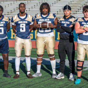 MALDEN 2024 FOOTBALL LEADERS: Pictured from left to right: Malden High football captains for the 2024 season are all seniors: James Hyppolite, Kervenson “Kevin” Exilhomme, Earl Fevrier, Matheus Brito and Aidan Brett. (Courtesy/The Maldonian/MHS Yearbook/Henry Huang photo)