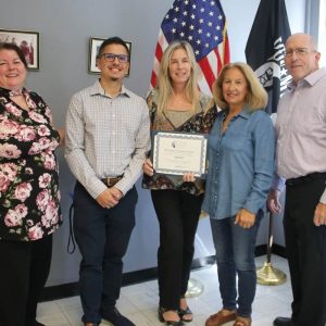 Shown from left to right: Portal To Hope Founder Deborah Fallon, Eagle Bank AVP Relationship Banking Manager Juan Lopez, Eagle Bank Sales & Services Supervisor Kelly Doherty, former bank employee Angela DiGiacomo and PTH Attorney Patrick Donoghue. Eagle Bank received the Business Leadership Award at City Hall on Wednesday.