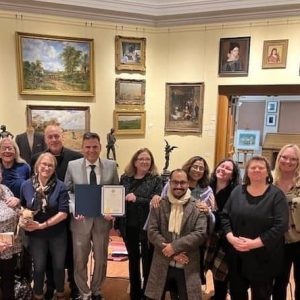 Malden Reads participants, Mayor Gary Christenson (with citation), Caron Guigli (right of Mayor) and Library Director Dora St. Martin (third from right) (Courtesy photo)