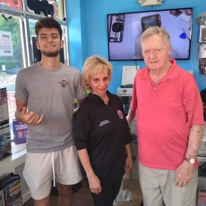 HELP LINE: Tech Exchange and Repair store owner Raphael Lopes (left) with Joanne Agnes and Jack O’Brien. (Courtesy photo)