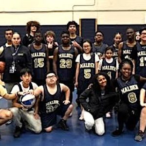 MALDEN UNIFIED TEAM: Coach April Edmunds (center) joined with Malden Director of Athletics Charlie Conefrey (left) and Malden High School Principal Chris Mastrangelo in congratulating the Unified Basketball Team and the helpers from the Malden Boys and Girls Varsity Basketball Teams. (Courtesy/Malden Public Schools)