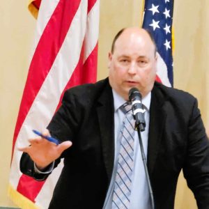 MINIMIZING THE RISK: Town Manager Scott C. Crabtree is shown during Monday’s Special Town Meeting advocating for the article establishing a multifamily overlay district on Route 1. He urged Town Meeting members to pass the article to protect the town from undesirable development while complying with state regulations. (Saugus Advocate photo by Mark E. Vogler)