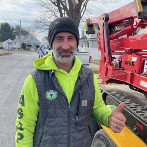 MISSION ACCOMPLISHED: Dante Hibbard, president of ASAP Tree Care, Inc., of Saugus, gave the thumbs up sign after completing the successful rescue of a cat named MeMe, which was stuck in a tree for more than 30 hours before he used his spider lift to reach it. (Courtesy photo by Jeannie Meredith to The Saugus Advocate