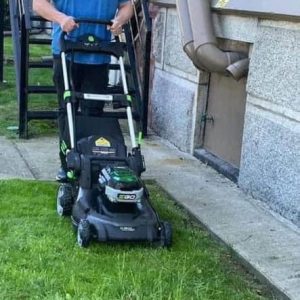 MOWING THE LAWN AT TOWN HALL: A recent photo of Town Manager Scott C. Crabtree cutting grass. (Courtesy photo to The Saugus Advocate)