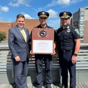 Pictured from left to right: Mayor Gary Christenson, Police Captain Dan Catana, Accreditation Manager, and Police Chief Glenn Cronin.