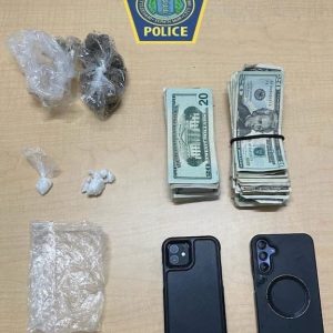 Following a traffic stop last week, Malden Police seized what is believed to be crack cocaine, cash and a pair of cellphones in the course of a suspect’s arrest. (Photo Courtesy of Malden Police Department)