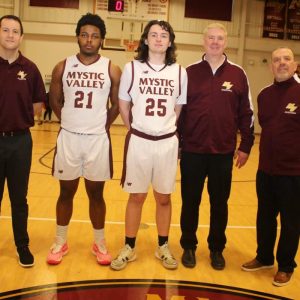 Seniors, shown from left to right: Assistant Coach Fran Brown, Jonathan Saint Vil, Charlie Jankowski, Assistant Coach George Hurley, and Head Coach Tony Ferullo last Friday night at Mystic Valley Regional Charter School.