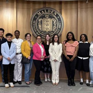 Pictured from left to right: Tenzin Thamchoe, Reda Benhafoun, Kidus Tsige, Devyn DiMarco, Councillor-at-Large Karen Colón Hayes, Ollie Dodge, Sophie Tran, Sarah Job, Giuliannah Dormevil and Serena Lama. Not shown: Thomas Conti, Julia Gamitto and Benny Mei.