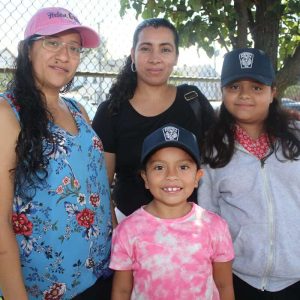 Maddie English School students: second-grader Kimberley Santos, 7, with her mother, Estela Santos, and fourth-grader Jackie Rodriguez, 9, with her mother, Silvia.