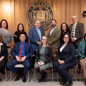 The Malden City Council voted unanimously on a resolution opposed to the use of municipal resources to assist any federal-based immigration law enforcement operations in Malden. The 2026-2027 City Council, pictured from left to right: Front row: Michelle Luong (At Large), Chris Simonelli (Ward 7), Council President Amanda Linehan (Ward 3), Ari Taylor (Ward 5) and Carey McDonald (At Large); back row: Peg Crowe (Ward 1), Jadeane Sica (Ward 8), Paul Condon (Ward 2), Ryan O’Malley (Ward 4), Karen Colón Hayes (At Large) and Stephen Winslow (Ward 6). (Courtesy/City of Malden)