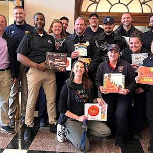 Some of the many Malden Police patrol officers, detectives and Police Chief Glenn Cronin (above, center) took part in the Read Across America event at the Beebe K-8 School. (Courtesy/Malden Police Department)
