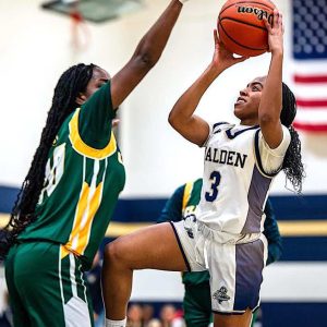 Malden’s Kimberly Tropnas (3) avoids a block and drives strong to the basket on this shot. (Advocate Photos/ Henry Huang)