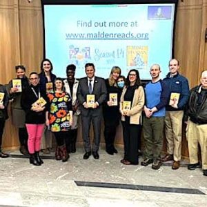 Pictured from left to right: School Committee Clerk Shirley Dorai; School Committee Members Keith Bernard (Ward 7); Sharyn Rose-Zeiberg (Ward 8); Dawn Macklin (Ward 4); Jennifer Spadafora (Ward 3, Vice Chair) and Elizabeth Hortie (Ward 4); student rep Meklit Abel; School Committee Chair Mayor Gary Christenson; Superintendent of Schools Dr. Ligia Noriega-Murphy; Malden Reads Co-Facilitator/Co-Founder Jodie Zalk and others; Ward 2 School Committee Member Rob McCarthy; a Malden Reads member and School Committee Members Michael Drummey (Ward 1) and Joseph Gray (Ward 6). (Advocate Photo)
