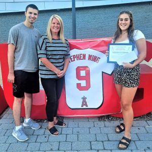 Marissa Patterson (right), the 2023 recipient of the Stephen Wing Memorial Scholarship, received her scholarship check and plaque from members of the Wing Family, Nick Cicolini and Kristin Wing Cicolini. (Courtesy photo to The Saugus Advocate)