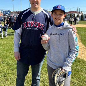 Cubs Starting Catcher Vincent Martinez caught the ball from Mayor Patrick Keefe during Revere Little League Opening Day ceremony on Saturday at Griswold Field. (Courtesy photo)