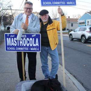 Ward 4 School Committee runner up Jim Mastrocola, along with his dog, Cheyenne and supporter Tom Toole, cover the polls on Tuesday.  (Advocate photo by Tara Vocino)