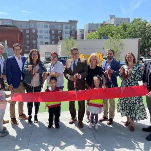 Pictured from left to right: Back row: Community Preservation Manager Dan Koff; OSPCD Director Alex Pratt; My Little Best Friends Early Learning Center Executive Director Hilda Torres; Ward 5 Councillor Ari Taylor; Mayor Gary Christenson; Preotle, Lane & Associates’ Tenant Relations Manager, Dawn Zanazzo; Ward 4 Councillor Ryan O’Malley; OSPCD Deputy Director Jane Ventrone; Landscape Architect John Gwozdz; front row: local playground enthusiasts Phoebe, Josiah and Althea. (Courtesy photo)