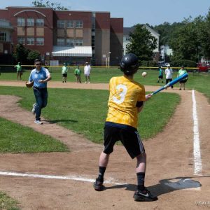 Mayor Gary Christenson takes a turn at the mound during the Challenger Day Games.