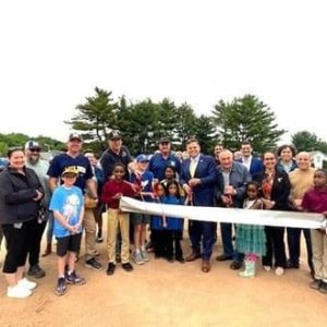 Mayor Gary Christenson cuts the ribbon with residents and Ward 6 Councillor Steve Winslow (left, holding scissors), Councillors-at-Large Karen Colón Hayes and Carey McDonald and State Representative Steve Ultrino. (Courtesy photo)