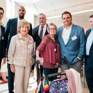 Shown from left to right; Ernani DeAraujo, EBNHC Chief Legal Officer; Greg Wilmot, EBNHC President and CEO; State Representative Joseph W. McGonagle, Jr., 28th Middlesex District; Mayor Carlo DeMaria; Senator Sal DiDomenico. Shown front, from left to right; Rita Sorrento, Chair of EBNHC’s Board of Directors.
