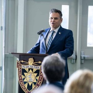 Malden Mayor Gary Christenson is shown addressing the attendees at the ribbon-cutting at Malden Catholic High School.