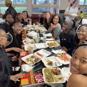 Members of the A.O. Step Team celebrate a successful Malden Juneteenth performance over lunch. (Photo credit: Rachel Sorlien)