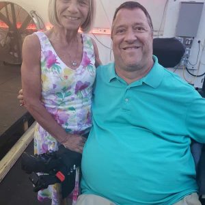 Michael R. Maruzzi (right) joined by his wife, Arlene, greeted the crowd at Kowloon Restaurant on June 27 when he did his book launch for “Walking is Overrated,” his inspirational story of overcoming life’s challenges 36 years after a hockey injury left him a quadriplegic. (Saugus Advocate Photo by Mark E. Vogler)