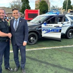Malden Mayor Gary Christenson (right) greets Malden Police Chief Glenn Cronin on National Night Out at Macdonald Stadium in Malden. Over 300 people participated in the event, which was hosted by the City of Malden and the local Police Department, Fire Department, Cataldo Ambulance and others. (Advocate Photo)